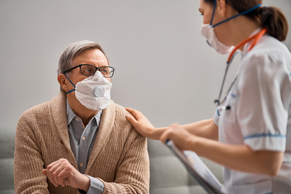 social worker looking after older man